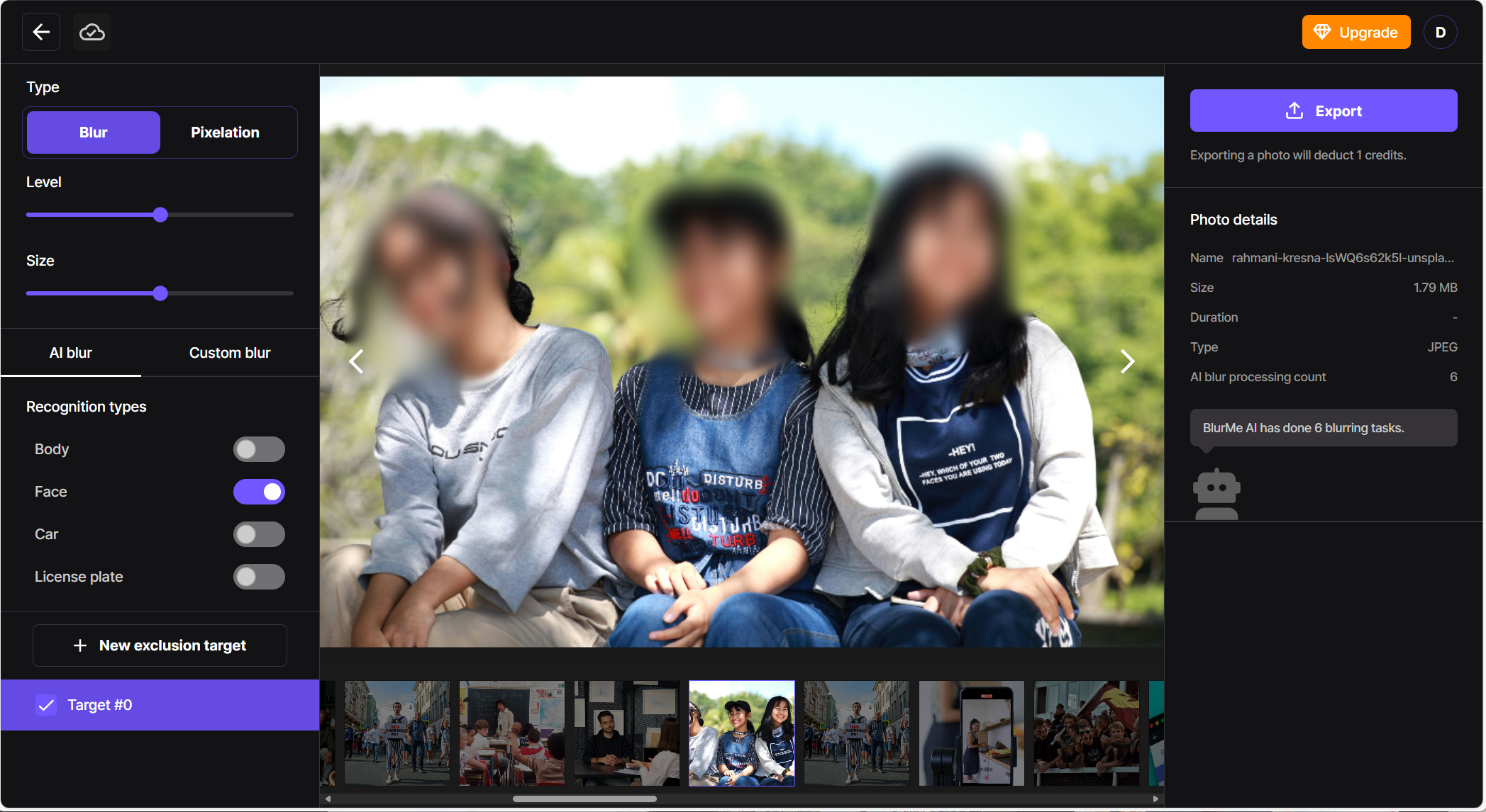 Photo showing multiple faces blurred using a face blur filter in BlurMe