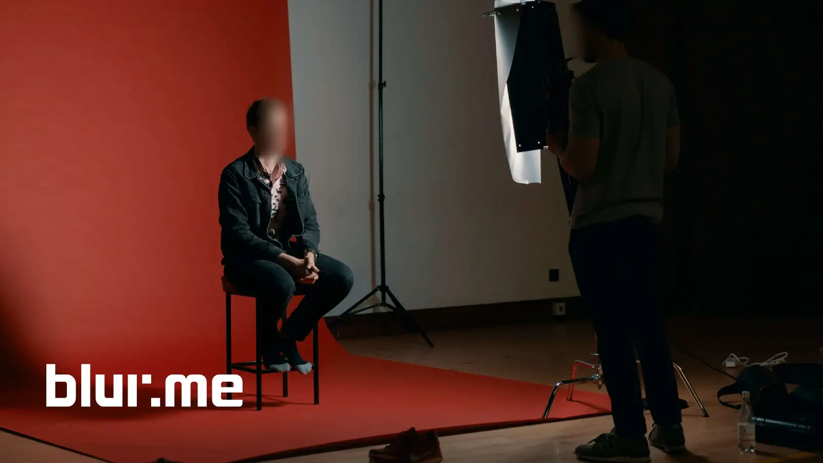 AI tool automatically blurring multiple faces in a video for privacy protection.
