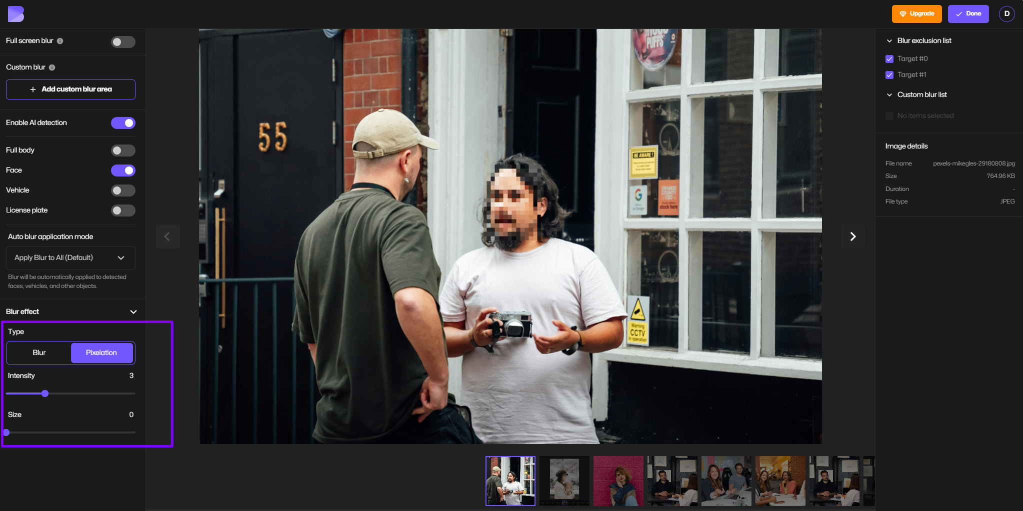 Adjusting pixelation on face in image.