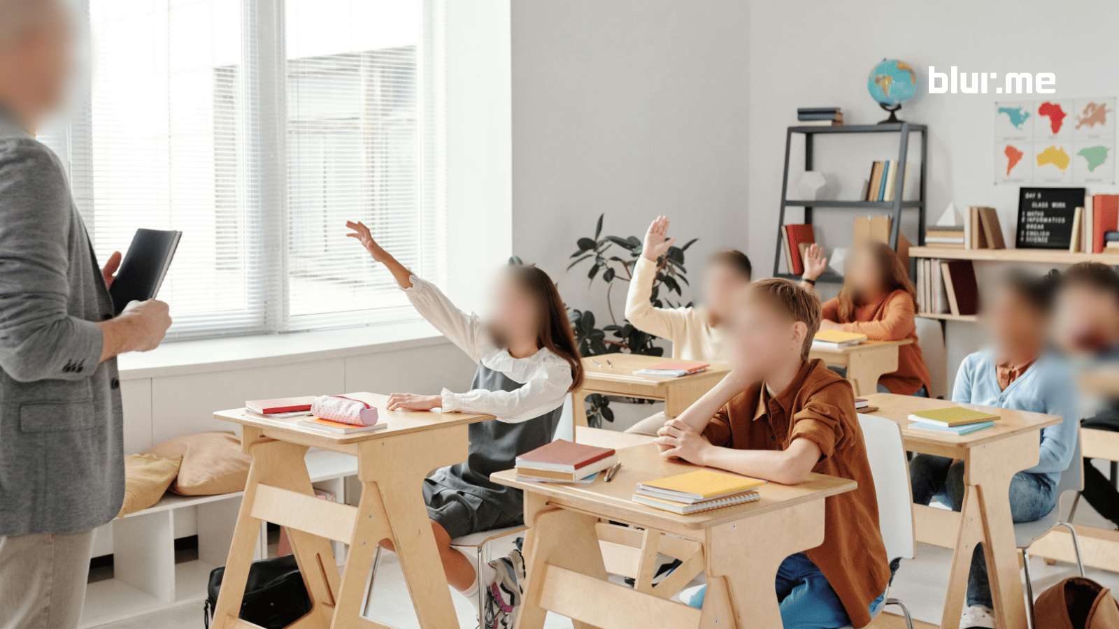 Classroom scene with students’ faces blurred by BlurMe AI Face Blur technology.